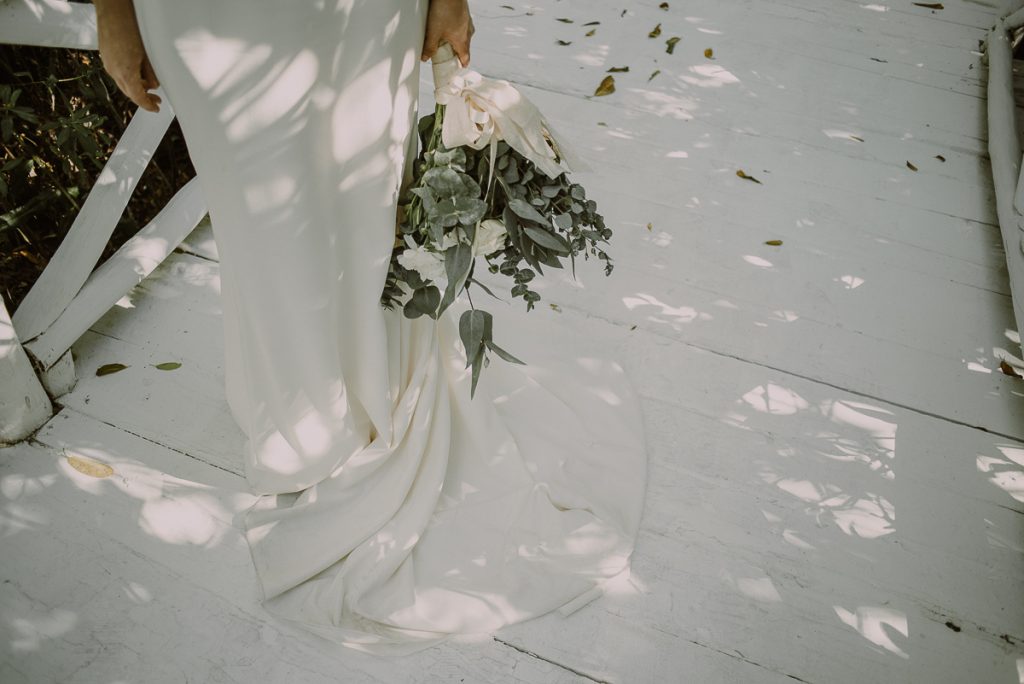 Wedding dress and bouquet detail by Caro Navarro Photography at Banyan Tree Mayakoba